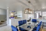 Dining for six, a built in wet bar, and galley kitchen